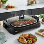 شواية صحية، غطاء زجاجي، تحكم في درجة الحرارة المتغيرة، صينية تجميع التنقيط، قنوات تصريف الزيت 1700 W HG230 أسود/شفاف